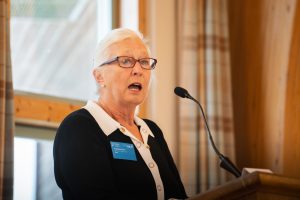 An image of Barbara Vann, Chair of Duchy Health Charity, speaking at a conference