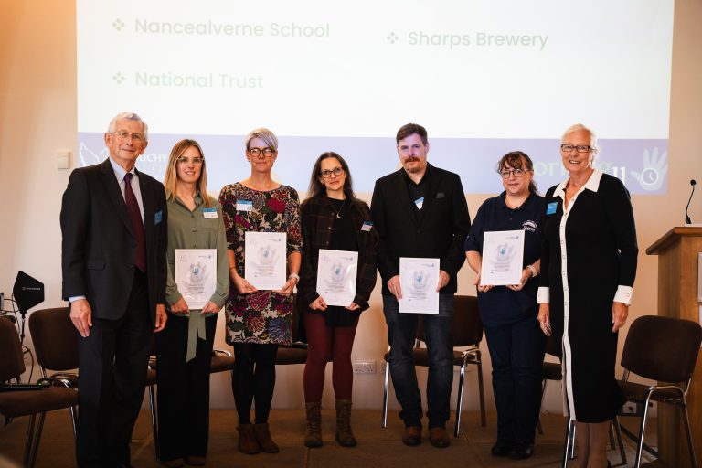 An image of award winners holding their certificates at Duchy Health Charity's Working Well Conference