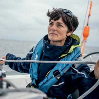 An image of Dame Ellen Macarthur on board a sailing yacht